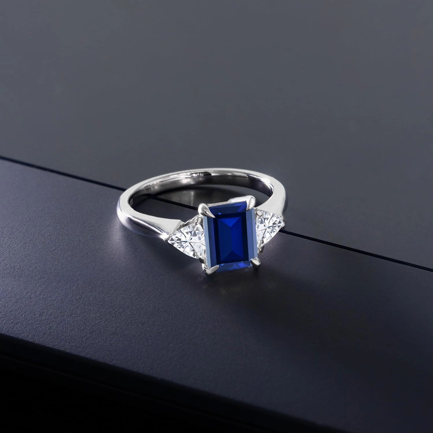 1.82 Cttw Blue Created Sapphire and White Moissanite 3-Stone Ring For Women | 925 Sterling Silver | 8X6MM Emerald Cut and 3.5 Trillion | Gemstone Birthstone | Available In Size 5, 6, 7, 8, 9