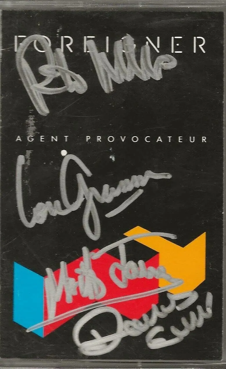Foreigner SIGNED Agent Provocateur cassette tape COA by Lou Mick Rick Dennis